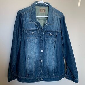 Woman’s Jean Jacket with metal buttons and adjustable band at the bottom.
